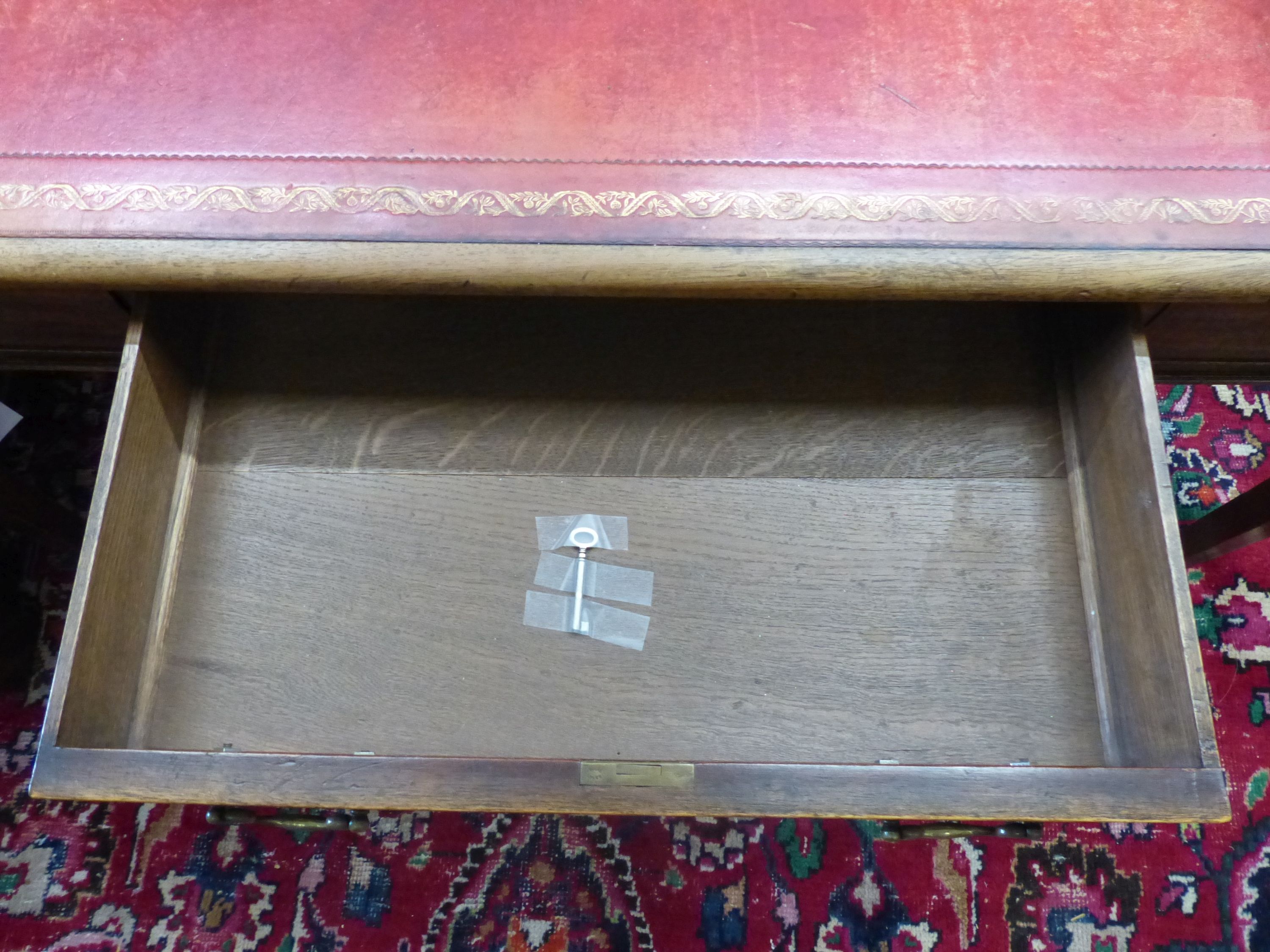 A George III style rectangular mahogany writing table, width 136cm, depth 91cm, height 75cm